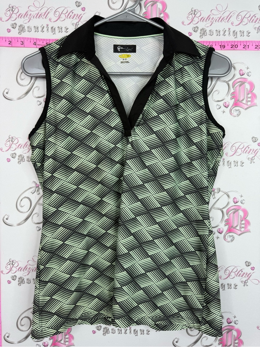 Greg Norman Collection Black and Light Green Geometric Sleeveless Polo Tank play